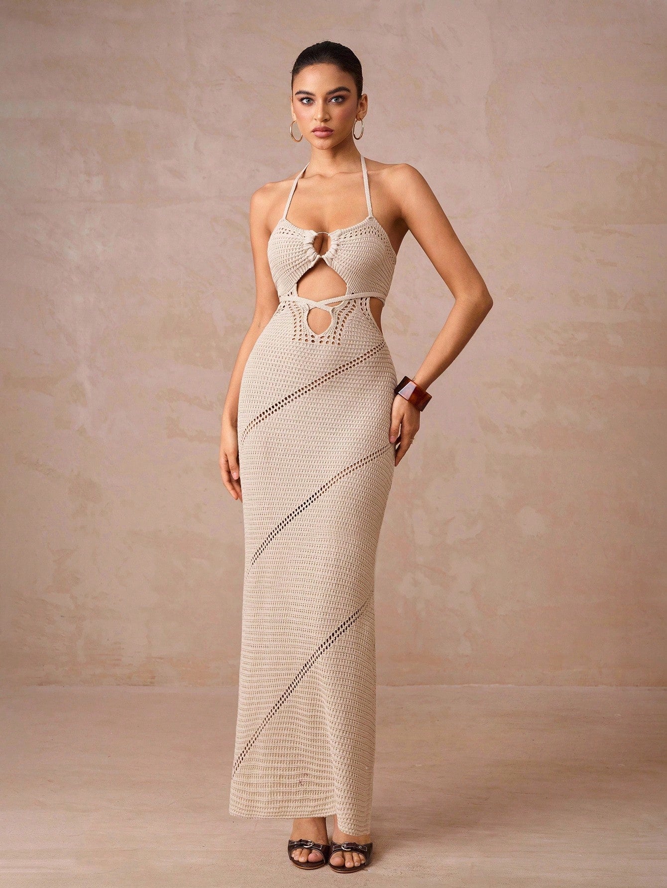 Slip into the Chic Autumn Hollow Knitted Maxi Dress and turn heads wherever you go. This slim-fit beauty hugs your curves with a sexy silhouette, perfect for concerts, romantic date nights, or elegant weddings. The airy hollow knit keeps you comfy while adding a touch of flirty charm. Dance, mingle, and sparkle all evening long in this effortlessly stylish fall favorite.