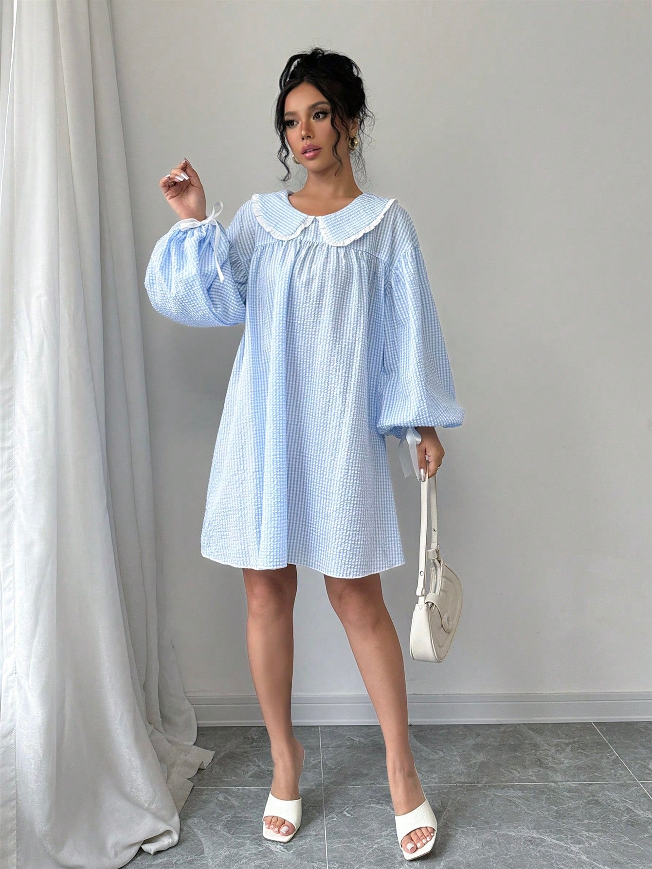 Look chic and fashionable this autumn in our A-Line dress that features a trendy plaid print. The ruffle collar and lantern sleeves add a touch of elegance to this must-have dress. Stay comfortable and stylish all season long.
