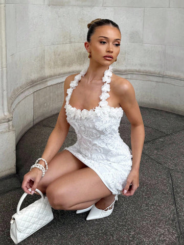 Turn heads at your next summer celebration in this stunning backless mini dress. Delicate embroidery and shimmering sequins create an eye-catching design that transitions effortlessly from beachside weddings to tropical getaways. The daring open back adds a flirty touch while the fitted silhouette flatters your figure. Whether you're dancing under the stars or sipping cocktails by the pool, this dress delivers the perfect blend of elegance and fun. Pack it for your next adventure and watch the compliments r