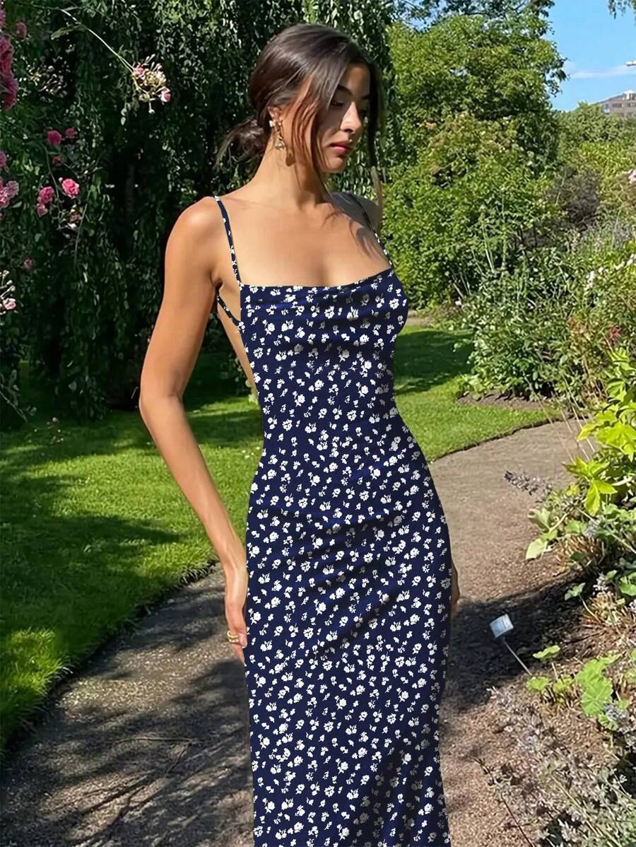 Embrace warm-weather elegance with this stunning backless floral print dress. Delicate spaghetti straps frame the shoulders while the open back design creates an effortlessly chic silhouette perfect for summer outings. The vibrant floral pattern adds a touch of romance and movement to any occasion—from casual brunches to evening gatherings. Lightweight and breathable, this dress moves with you throughout the day. 