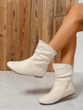 Upgrade your style effortlessly with our Chic Beige Crinkled Flat Casual Boots. Made with crinkled fabric, these boots add a subtle texture to any outfit. The flat heel provides comfort and stability, while the chic beige color effortlessly matches any look. Enhance your wardrobe with these versatile and stylish boots.