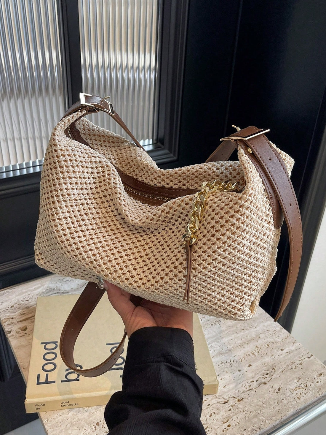 Add a touch of vintage charm to your summer adventures with this chic beige straw woven shoulder bag. Featuring a playful chain zipper design, it’s perfect for beach days and travel, keeping your essentials stylishly secure. Lightweight and roomy, it’s your new sunny-season sidekick!