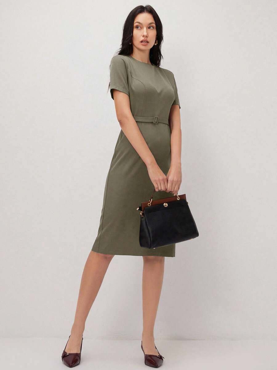 Effortless elegance meets everyday versatility in this stunning pullover dress. The classic round neckline and sleek black silhouette create a timeless foundation, while the apricot accent details add a subtle pop of warmth and sophistication. The included belt cinches at the waist for a flattering, defined shape that transitions seamlessly from the office to weekend outings. Crafted for comfort and style, this dress works beautifully for professional settings, casual gatherings, and special occasions. 