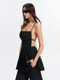 Step into the spotlight with this chic black backless dress, designed to turn heads all spring and summer. Featuring playful strappy details and flattering ruching, it effortlessly combines elegance with a flirty vibe. Perfect for warm evenings and stylish outings, this dress lets you show off your confident, fun-loving side with every step.