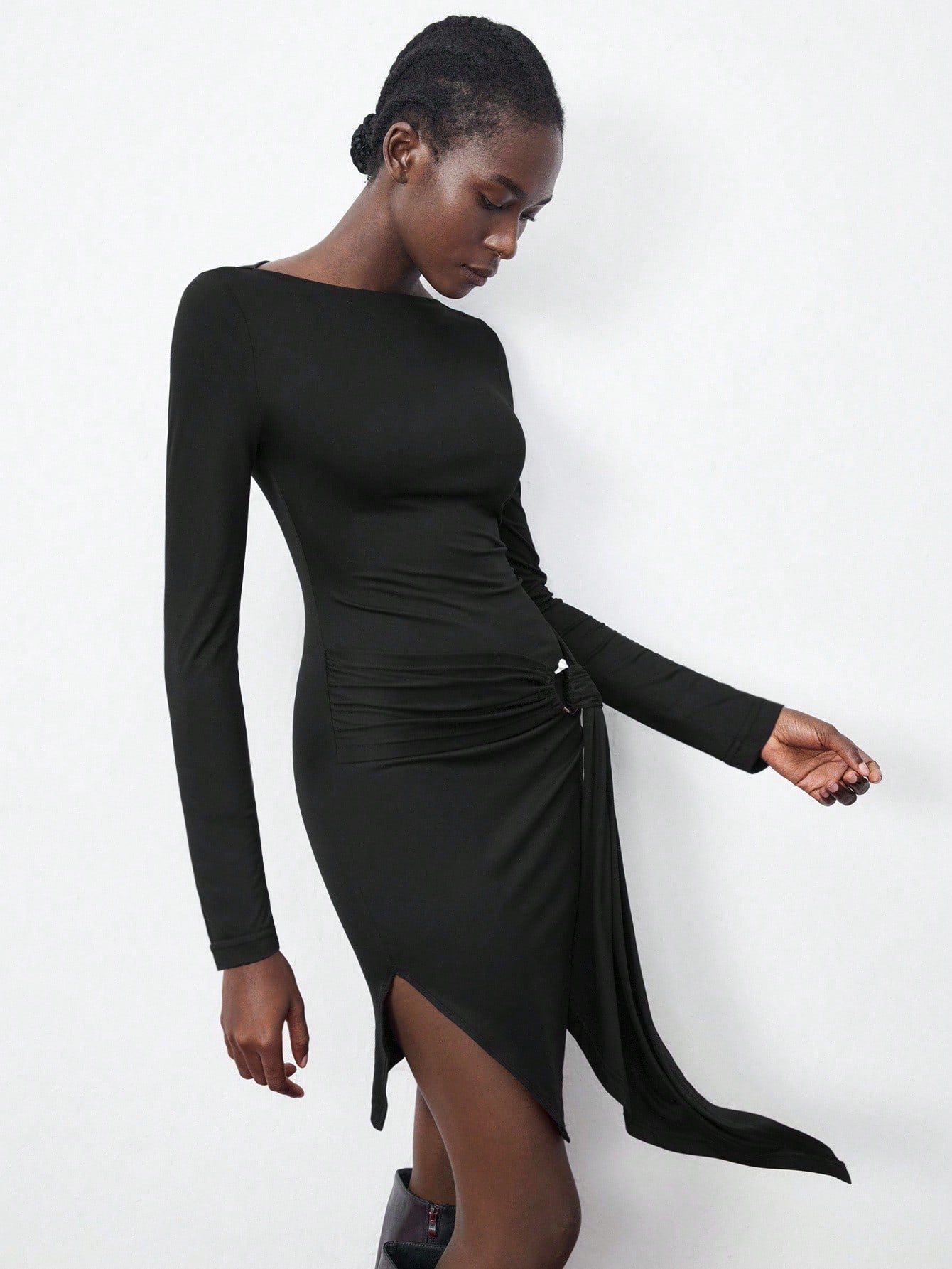 Turn heads this autumn in our Chic Black Boat Neck Mini Dress, designed to flatter with stylish ruched sides. This playful yet elegant dress offers a sleek silhouette perfect for day-to-night wear. Embrace the season’s charm with a versatile piece that pairs effortlessly with boots or heels, making every outing a little more special.