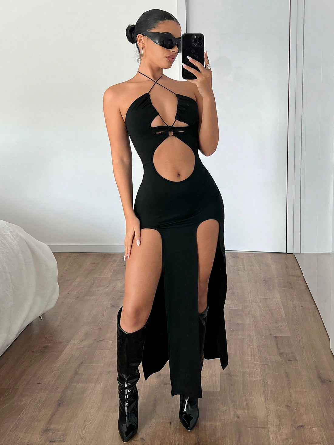 Turn heads this summer in our Chic Black Bodycon Dress, designed to hug your curves with a flattering halter neck and a daring high slit. Perfect for warm nights and stylish days, this dress combines elegance with a flirty edge—bringing out your confident, playful side wherever you go.