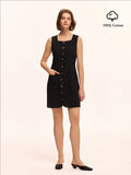 Embrace effortless chic with this black cotton button-down tank dress, inspired by French minimalist style. Its sleeveless design keeps things cool and breezy, while the button-down front adds a playful twist. Perfect for sunny days or layering up, this dress is your new go-to for easy, stylish vibes.