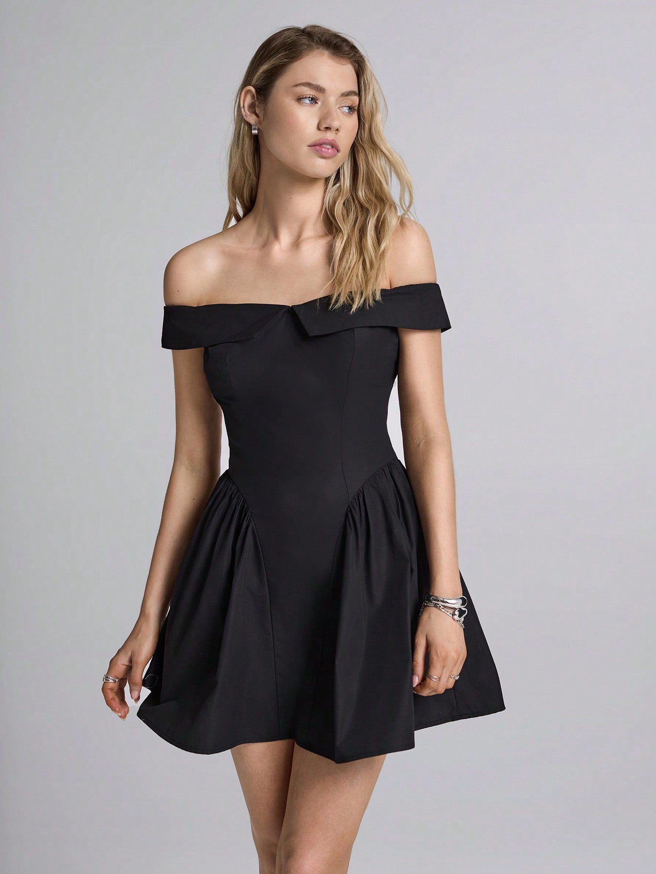 Step out in style with this Chic Black Knit Off-Shoulder Dress, designed to bring casual elegance to your wardrobe. Its soft knit fabric hugs your curves while the off-shoulder neckline adds a flirty touch. Perfect for brunch dates or evening strolls, this dress combines comfort with a playful, sophisticated vibe. Elevate your everyday look effortlessly!