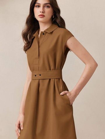 Step into sophistication with this Chic Black Lapel Dress designed to flatter every figure thanks to its adjustable waist. Perfect for conquering the office or adding a dash of elegance to your everyday look, this dress merges classic style with a playful twist. Effortless to style and irresistibly comfortable, it’s your new go-to for making an impression wherever you go.