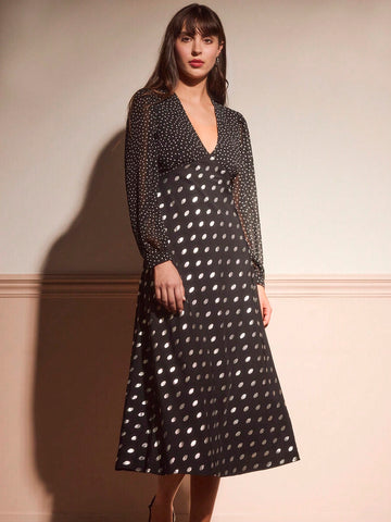 Elevate your autumn wardrobe with this stunning black midi dress that's equal parts sophisticated and fun. The vintage-inspired V-neckline and long sleeves offer timeless elegance, while shimmering metallic polka dots add a playful sparkle that catches the light beautifully. Perfect for dinner dates, cocktail parties, or any occasion calling for effortless chic style. The midi length provides a flattering silhouette that works for any body type, making this dress a versatile go-to piece for the cooler month