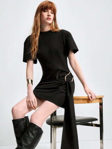 Step out in style with this chic black mini dress featuring bold shoulder pads and a sleek metal buckle. Perfect for adding a touch of edge to your look, it combines classic elegance with a playful twist. Whether you're hitting the town or a special event, this dress ensures you stand out with confidence and flair.