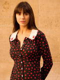 Elevate your autumn wardrobe with this stunning black mini dress that perfectly blends sophistication with seasonal charm. The vibrant red floral print adds a pop of color and personality, while the intricately embroidered collar brings an unexpected touch of elegance. Designed for effortless style, this dress transitions seamlessly from casual day outings to evening gatherings. The flattering mini silhouette pairs beautifully with boots, sneakers, or heels, making it a versatile staple for any fashion-forw