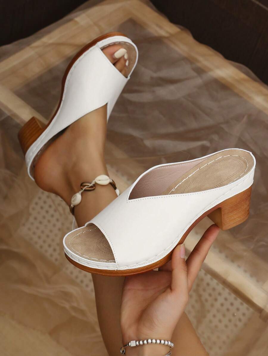 Step into summer with these chic black open-toe slide sandals! Featuring a thick heel for extra comfort and a stylish wedge design, they’re perfect for adding a playful touch to any outfit. Whether you’re strolling by the beach or heading out for brunch, these sandals bring effortless flair and all-day ease to your warm-weather wardrobe.