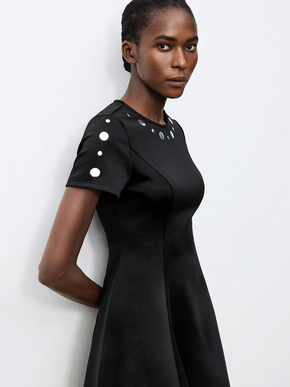 Step into the spotlight with this playful black polka dot short dress, sparkling subtly with metallic foil accents. Its lightweight, flirty silhouette makes it your go-to for autumn parties, effortlessly blending charm and fun. Perfect for dancing the night away or cozying up at a festive gathering, this dress adds a pop of joyful elegance to your seasonal wardrobe.