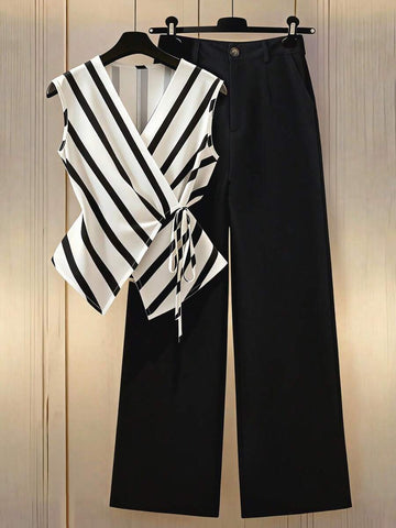 Elevate your everyday wardrobe with this sophisticated black and white striped 2-piece set, designed for effortless spring and summer style. The sleeveless V-neck blouse features a button front and functional pockets, paired with long, regular-fit pants for a polished silhouette. Crafted from a breathable polyester blend with subtle elastane stretch, this set transitions seamlessly from office to weekend outings. 