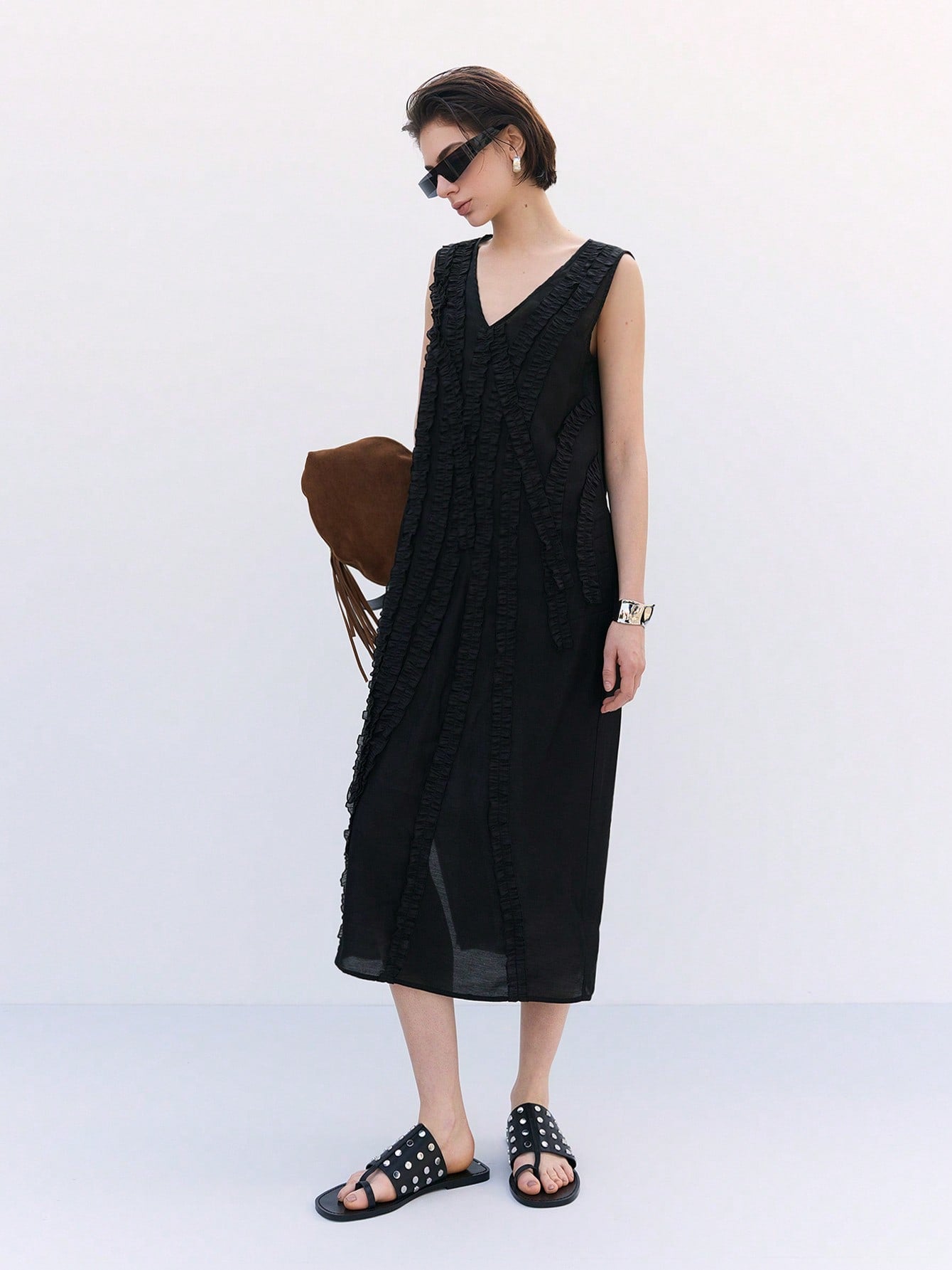 Step out in style with this chic black woven sleeveless summer dress designed for women who love to turn heads. Its lightweight fabric keeps you cool while the sleek silhouette flatters every curve. Perfect for sunny days, casual outings, or evening fun, this dress adds a playful yet elegant touch to your wardrobe. Embrace effortless fashion and make every outing a stylish adventure!