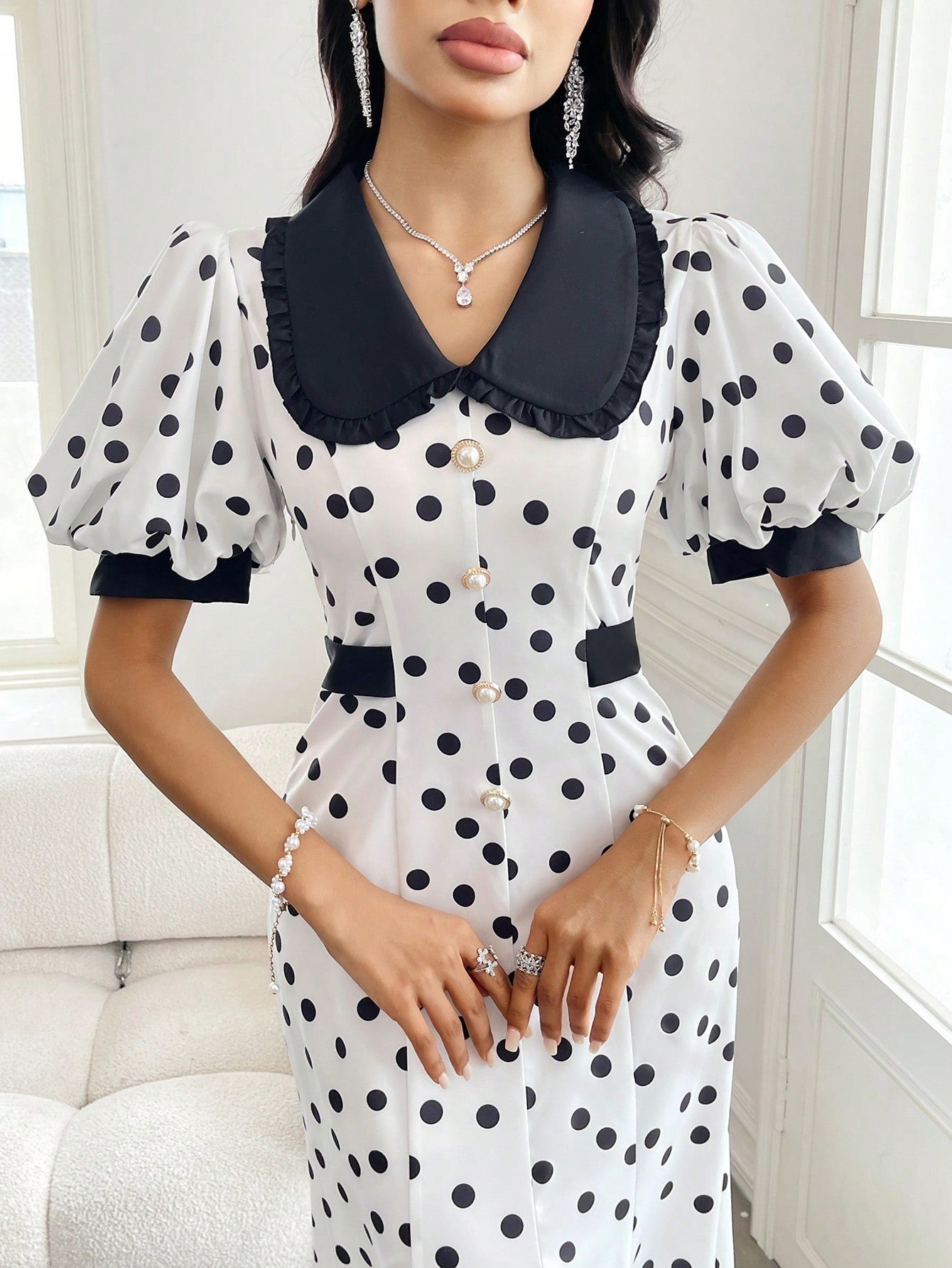 This playful puff sleeve dress combines classic black and white patterns with a charming Peter Pan collar for an irresistible retro vibe. The statement sleeves add a touch of drama, while the timeless color palette ensures versatility for both casual outings and special occasions. Slip it on to instantly elevate your style game with a dash of whimsy!