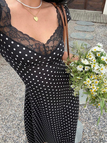 Step into spring and summer with this playful black and white polka dot midi dress, crafted to bring charm and elegance to your wardrobe. Featuring delicate lace trim and a whimsical heart-shaped collar, this dress is perfect for sunny days and evening outings alike. Its flattering midi length pairs effortlessly with sandals or heels, making it a versatile choice for any occasion. Embrace fun sophistication and let your style bloom!