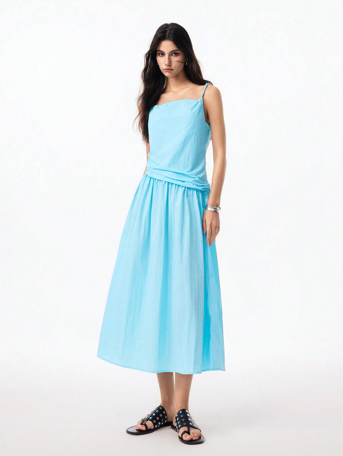Step into summer with this playful blue asymmetrical dress featuring charming knotted straps. Its breezy design keeps you cool whether you're strolling the beach or enjoying a sunny day out. The unique cut adds a fun twist to your wardrobe, making it a go-to for effortless style and comfort.