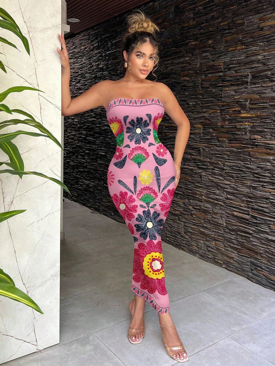 Pink strapless floral bodycon maxi dress styled indoors with clear heels