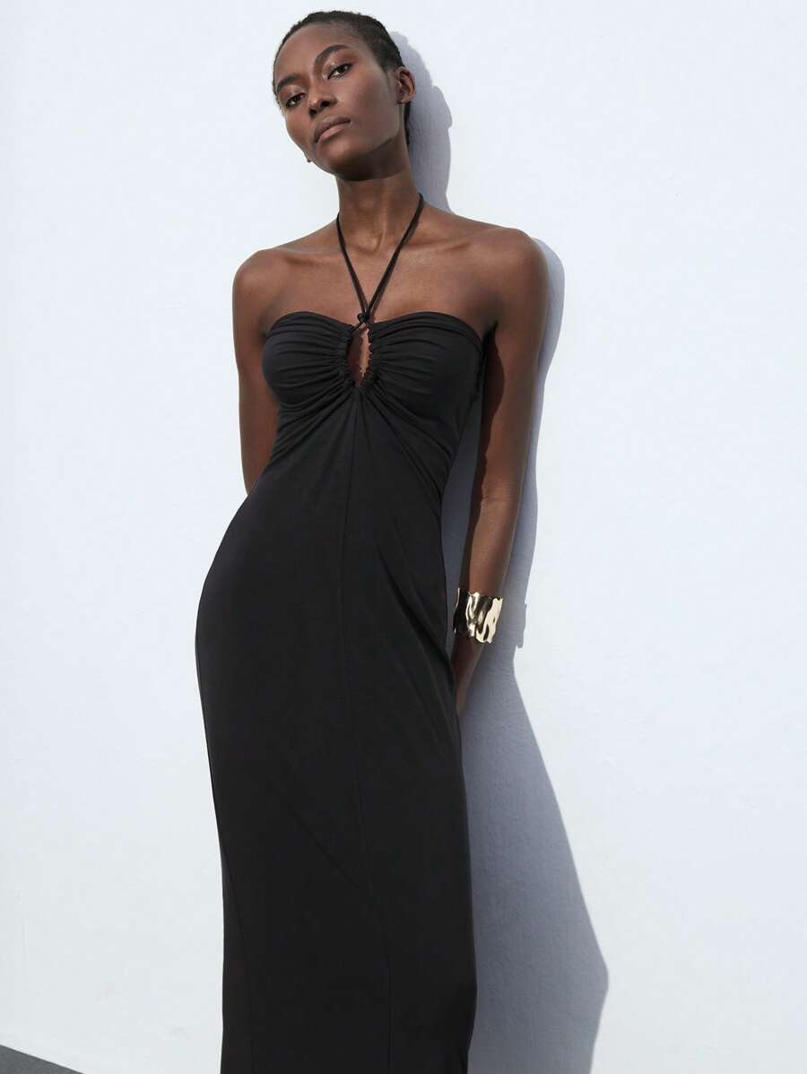 Step into style with this chic blue halter neck dress, crafted to turn heads at any fall or winter event. The playful drawstring waist lets you customize your fit, while the hollow-out details add a flirty touch of elegance. Perfect for layering or wearing solo, this dress balances cozy vibes with a bold, fashionable twist. Dance through the season with confidence and charm in this standout piece!