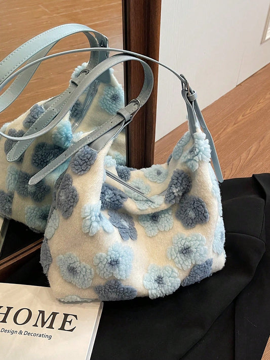 Introducing the Chic Blue Plush Bucket Bag - perfect for autumn and winter. This bag features a stylish floral design and plush material that is both fashionable and functional. The unique bucket shape allows for plenty of storage space, making it the perfect accessory for any outfit.