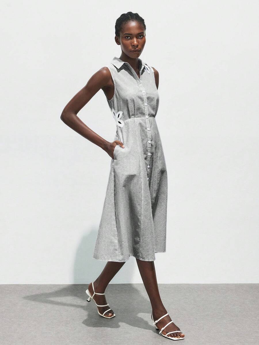 Stripes meet florals in this breezy summer essential that does the styling for you. The crisp blue and white palette keeps things fresh and versatile, while delicate embroidered blooms add a touch of whimsy. Lightweight and effortlessly chic, this dress transitions seamlessly from casual brunch to sunset strolls. Perfect for anyone who wants to look put-together without trying too hard—just slip it on and let the pattern do the talking.