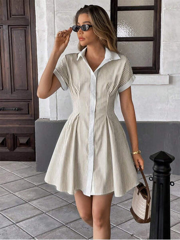 Step into vacation mode with this playful blue and white striped shirt dress. Its mid-length cut and cinched waist create a flattering silhouette perfect for sunny days and beach strolls. Lightweight and breezy, this dress blends comfort with effortless style—your go-to for an easy yet chic getaway look.