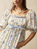 Step into effortless style with this chic bohemian mini dress, featuring a vibrant floral print that’s perfect for sunny getaways. The playful puff sleeves and flattering square neckline add a touch of whimsy, while the breezy silhouette keeps you comfortable all day long. Ideal for casual vacations, this dress brings a fun, flirty vibe wherever you go.