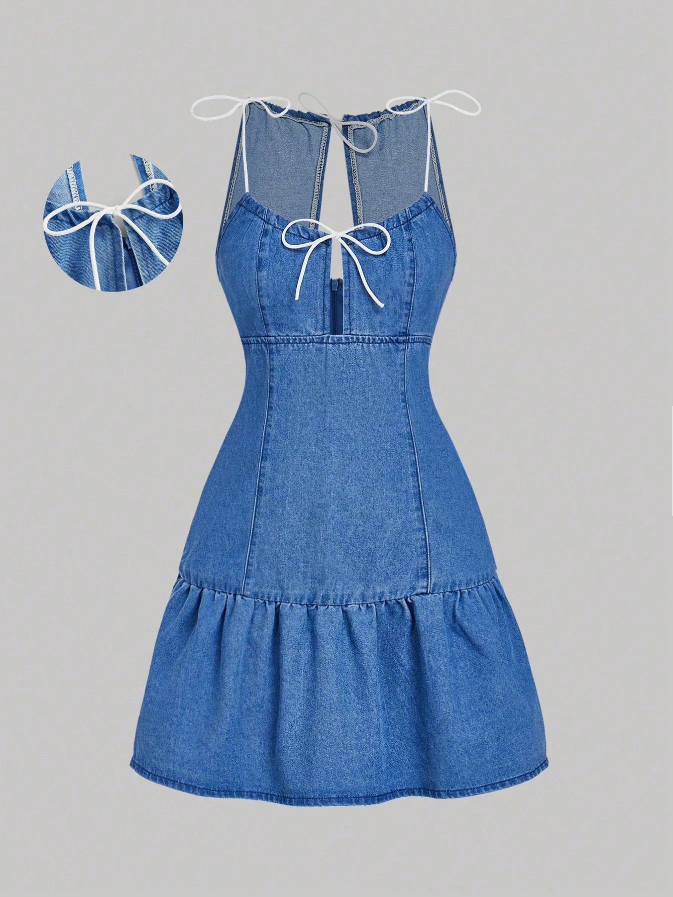 Get ready to strut your stuff in this chic denim dress! With a playful bow accent and flirty ruffle hem, this sleeveless dress is perfect for fashion-forward women. Say goodbye to boring outfits and hello to style that stands out. (Bow and ruffle included - no assembly required!)