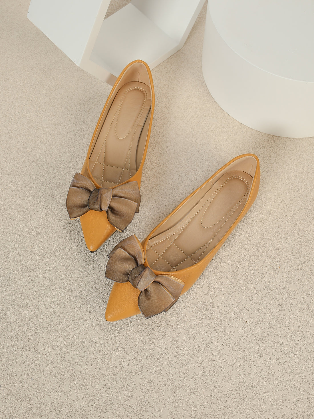 Effortlessly chic and stylish, these pointed toe ballet flats are the perfect addition to your Valentine's Day ensemble. With a playful bow decor, these flats elevate any outfit with a touch of romance. Walk with style and comfort this Valentine's Day!
