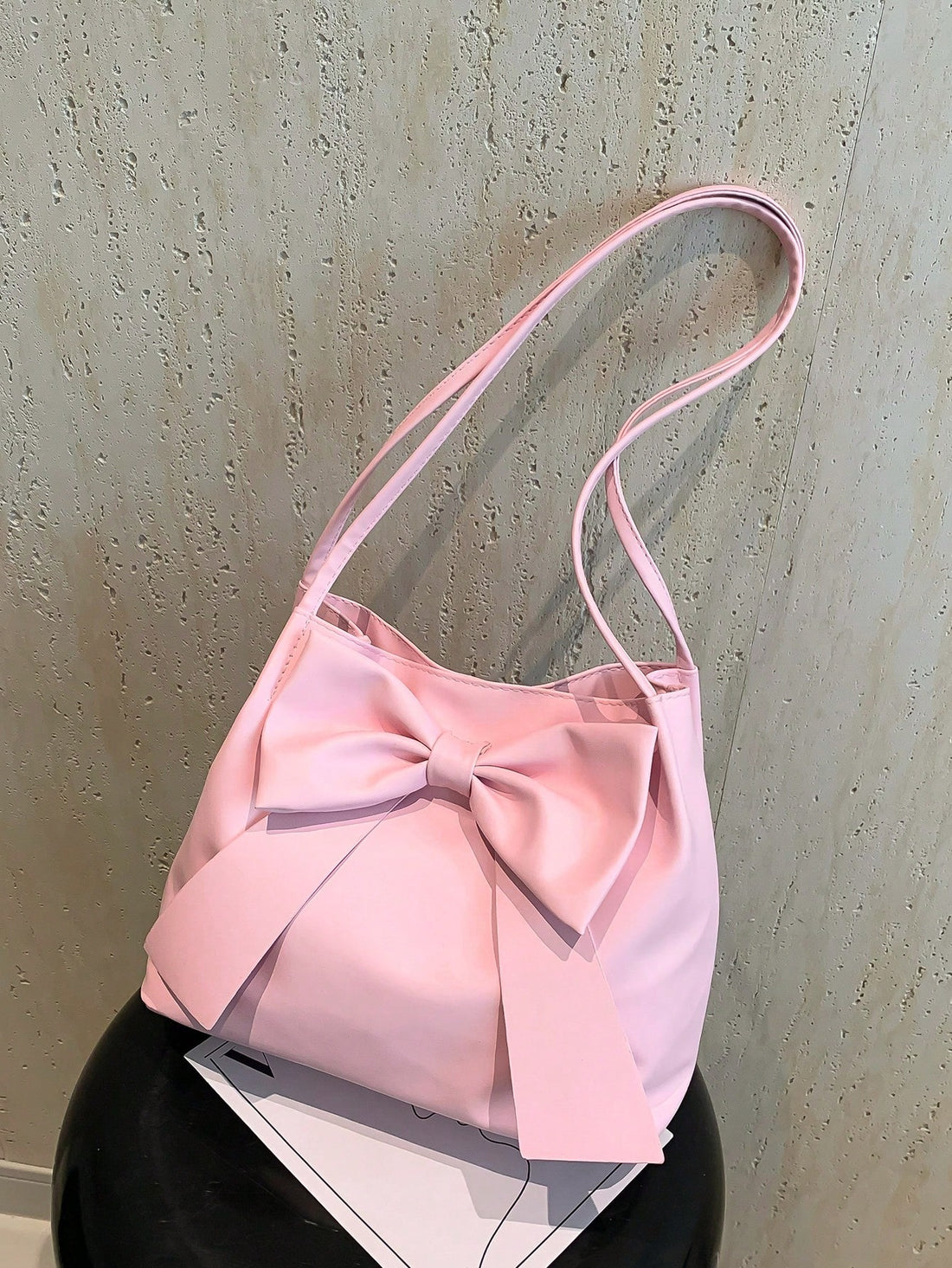 Expertly designed for fashionistas, this hand-held shoulder bag is both chic and versatile. Its sleek design and high-quality materials make it the ultimate accessory for any outfit. With its spacious interior and sturdy construction, it is the perfect blend of style and functionality.