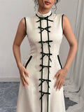 Effortlessly elegant, this sleeveless maxi dress with a chic bow tie is perfect for any occasion. Make a statement with this versatile and stylish dress that will elevate any outfit. You'll exude confidence and charm with this playful and quirky addition to your wardrobe.