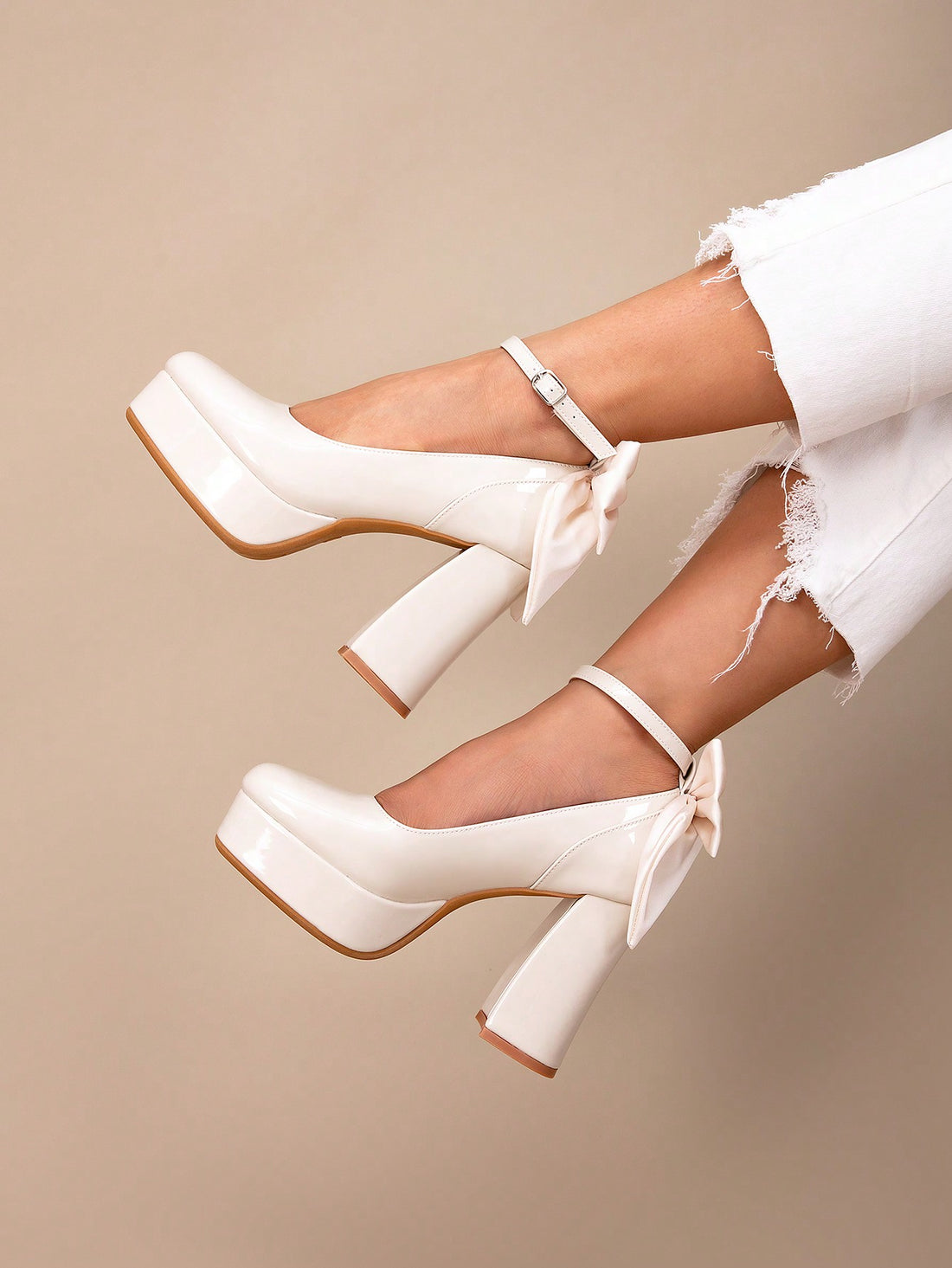 Elevate your look with these Chic Bowknot Peep-Toe Platform Heels. Perfect for parties and weddings, they add a touch of elegance and style to any outfit. The bowknot detail adds a feminine touch while the platform heel provides comfort and stability. Make a statement and stand out at any event with these chic heels.
