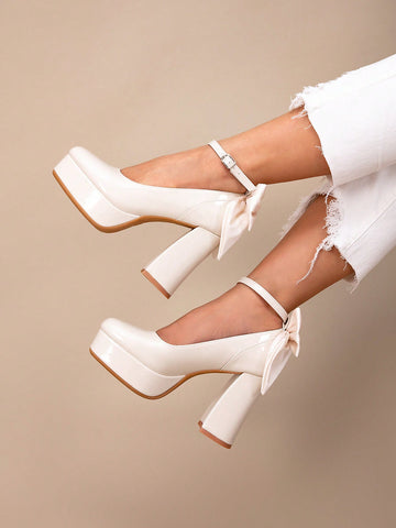 Elevate your look with these Chic Bowknot Peep-Toe Platform Heels. Perfect for parties and weddings, they add a touch of elegance and style to any outfit. The bowknot detail adds a feminine touch while the platform heel provides comfort and stability. Make a statement and stand out at any event with these chic heels.