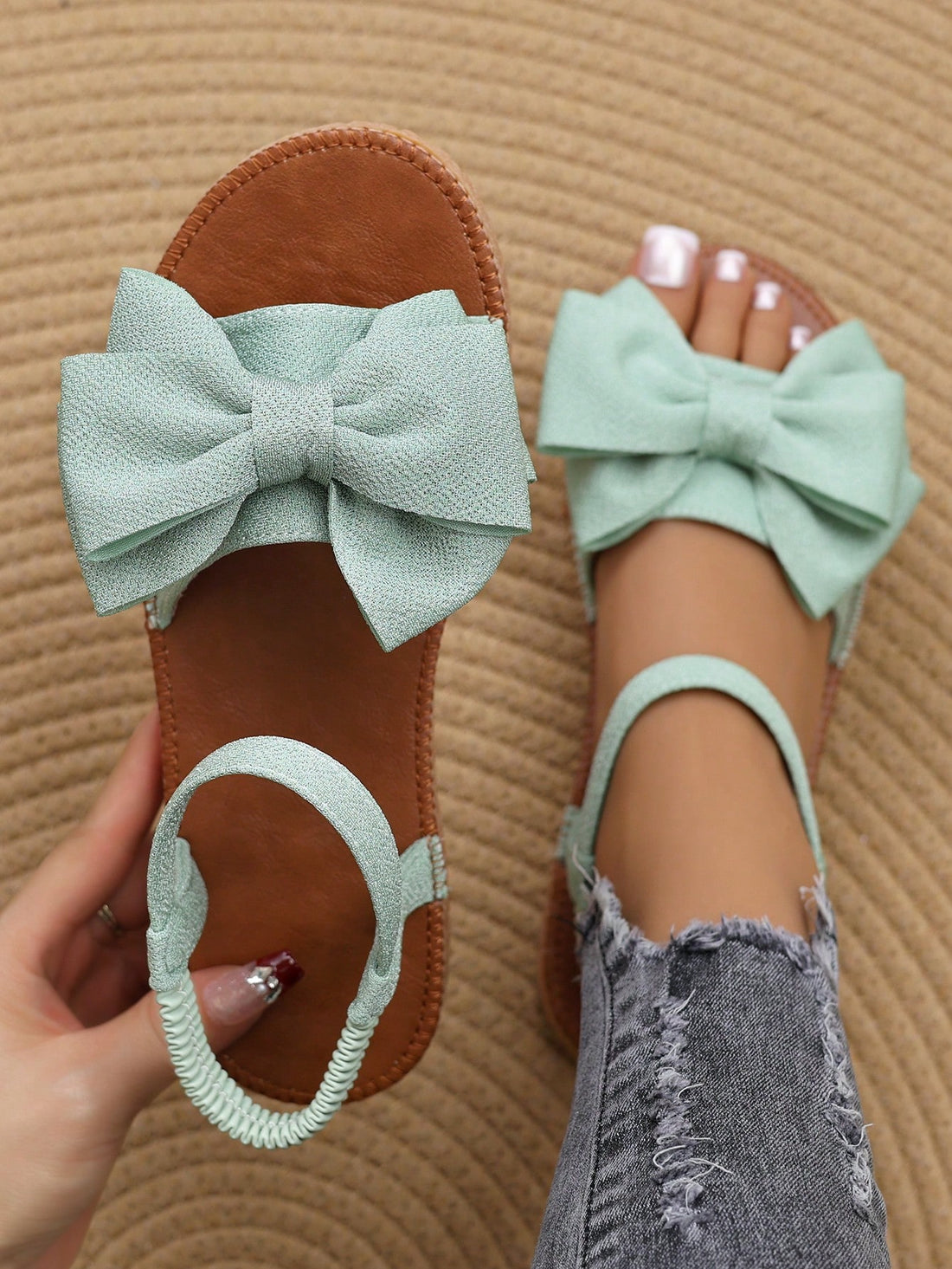 Elevate your style with our chic British-inspired green bowknot slingback sandals. These sandals not only add a touch of effortless style to your outfit, but also offer superior comfort with their slingback design. Perfect for any occasion, these sandals are a must-have in every fashion-forward wardrobe.