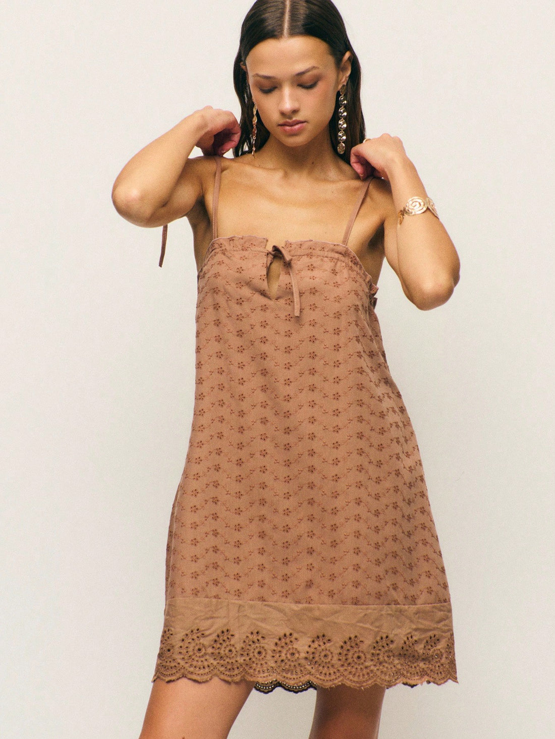 Embrace your inner woodland fairy with this enchanting brown dress that effortlessly blends whimsy with sophistication. Featuring delicate embroidered details and charming eyelet accents, this piece captures the essence of modern fairycore style. The adjustable tie straps offer a flattering fit while the layered silhouette creates beautiful dimension perfect for autumn adventures. Whether you're channeling cottagecore vibes or adding a touch of magic to your everyday wardrobe, this dress is your ticket to l