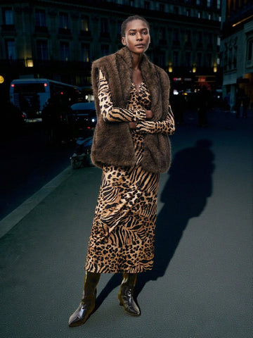 Turn heads with this chic brown leopard print dress designed to hug your curves just right. The long sleeves add a touch of elegance while the fitted silhouette keeps things sexy and playful. Perfect for making a bold statement at any event, this cheetah-inspired piece brings out your wild side with effortless style.