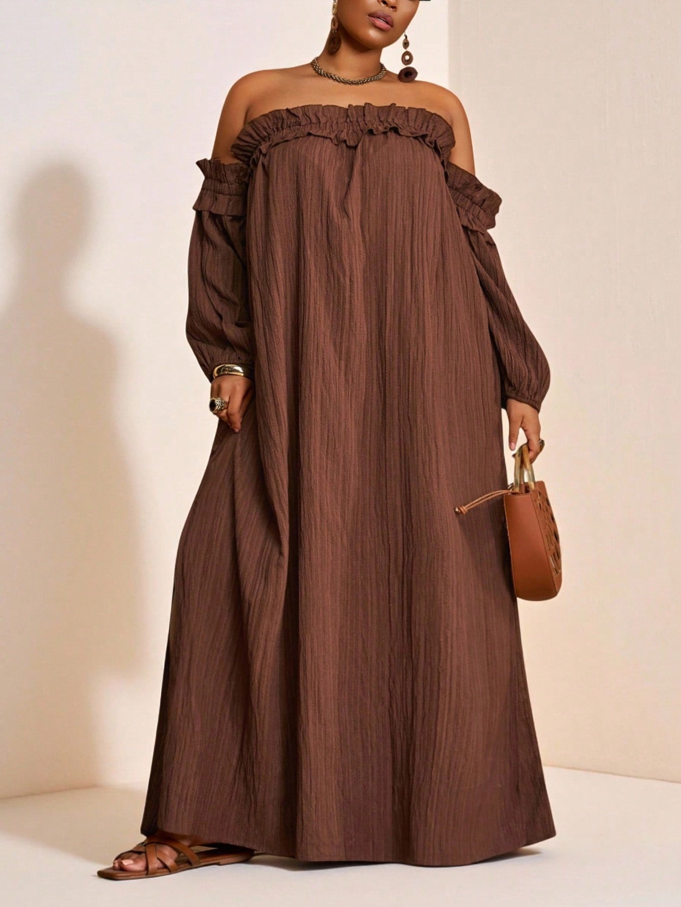 Step into summer with this Chic Brown Off-Shoulder Ruffle Maxi Dress, perfect for sunny vacations and playful days. Its flirty ruffles and breezy silhouette keep you cool and stylish, while the off-shoulder design adds a touch of fun sophistication. Available in plus sizes, it’s designed to celebrate every curve with comfort and charm. Let your vacation wardrobe shine with effortless elegance and carefree vibes!