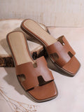 Step into effortless style with our Chic Brown PU Leather H-Shaped Flat Sandals. These trendy and casual sandals are perfect for your summer wardrobe. Made with high-quality PU leather, they provide both comfort and durability. Elevate any outfit with these versatile and chic sandals!