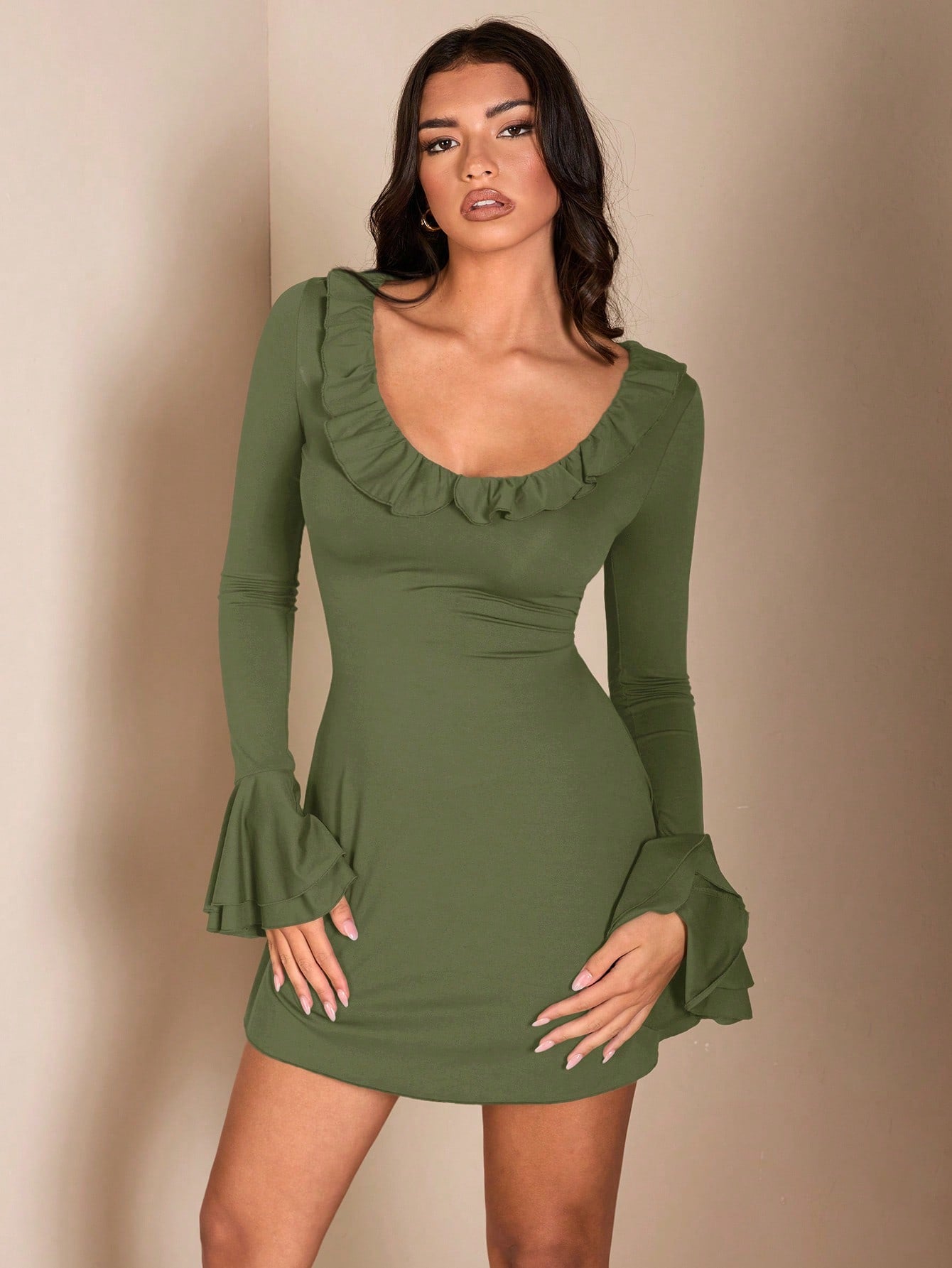 Fall in love with our chic brown mini dress, featuring charming ruffle trim. Perfect for romantic autumn nights or everyday wear.