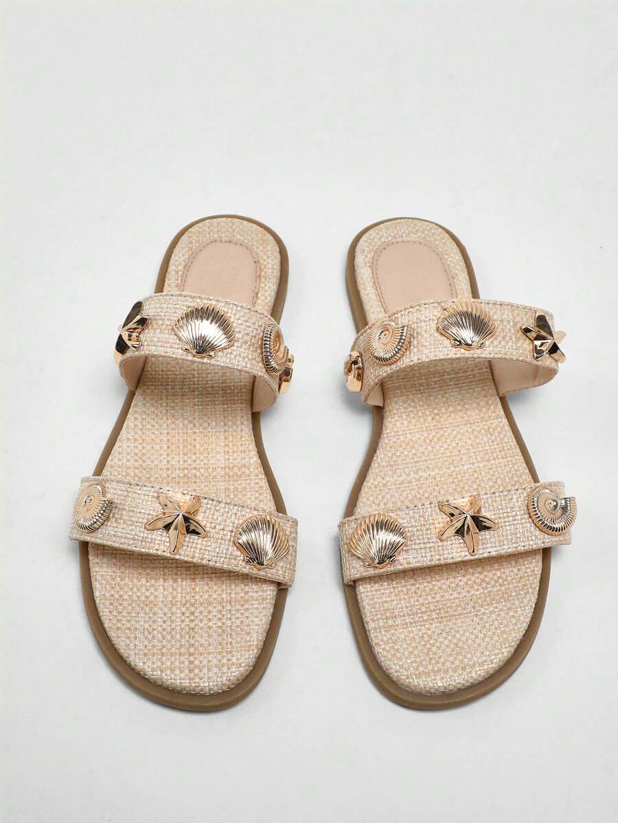 Step into summer fun with these Chic Brown Two-Strap Slider Sandals, featuring a playful gold seashell design that adds a splash of flair to every step. Designed with a non-slip sole, they keep you steady whether you’re strolling on the sandy shore or lounging poolside. Lightweight and breezy, they’re your perfect companion for warm spring and summer days full of sunshine and adventure.