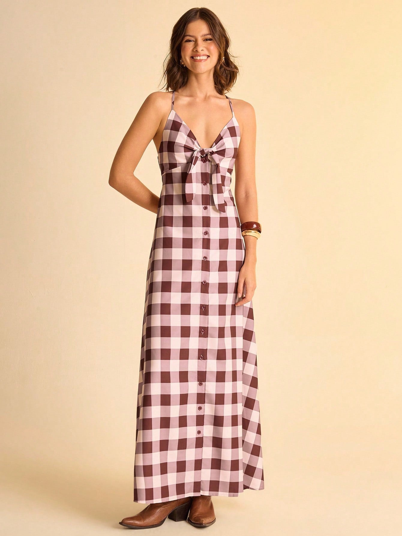 Step into sunny days with this Chic Brown and White Plaid V-Neck Sleeveless Dress. The playful tie knot detail adds a flirty twist, while its breezy sleeveless design keeps you cool and comfy. Perfect for effortless summer vibes, this dress blends classic plaid with a fun, fresh silhouette you'll want to wear everywhere.