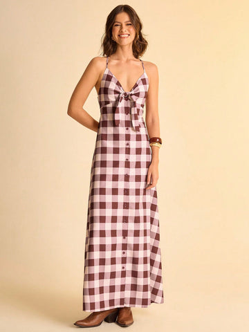 Step into sunny days with this Chic Brown and White Plaid V-Neck Sleeveless Dress. The playful tie knot detail adds a flirty twist, while its breezy sleeveless design keeps you cool and comfy. Perfect for effortless summer vibes, this dress blends classic plaid with a fun, fresh silhouette you'll want to wear everywhere.