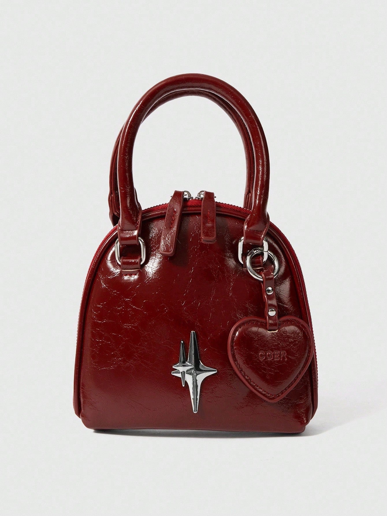 Steal hearts this Valentine's Day with our adorable burgundy heart-shaped clamshell bag! This charming accessory combines romance with practicality, featuring a secure clamshell closure that keeps your essentials safe while turning heads. The rich burgundy hue adds a touch of sophistication to any outfit, whether you're dressing up for date night or keeping it casual. Perfect for gifting to that special someone—or treating yourself to a little love. Compact yet spacious enough for your phone, cards, and eve