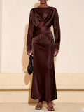 Elevate your wardrobe with this stunning burgundy two-piece set that does the heavy lifting for you! The flattering V-neck wrap top cinches at just the right spot, while the sleek straight skirt skims your silhouette beautifully. Whether you're toasting at a wedding, brunching with friends, or keeping it casual on the weekend, this versatile duo transitions seamlessly from occasion to everyday. The rich burgundy hue pairs with practically everything in your closet, making it the go-to set you'll reach for a