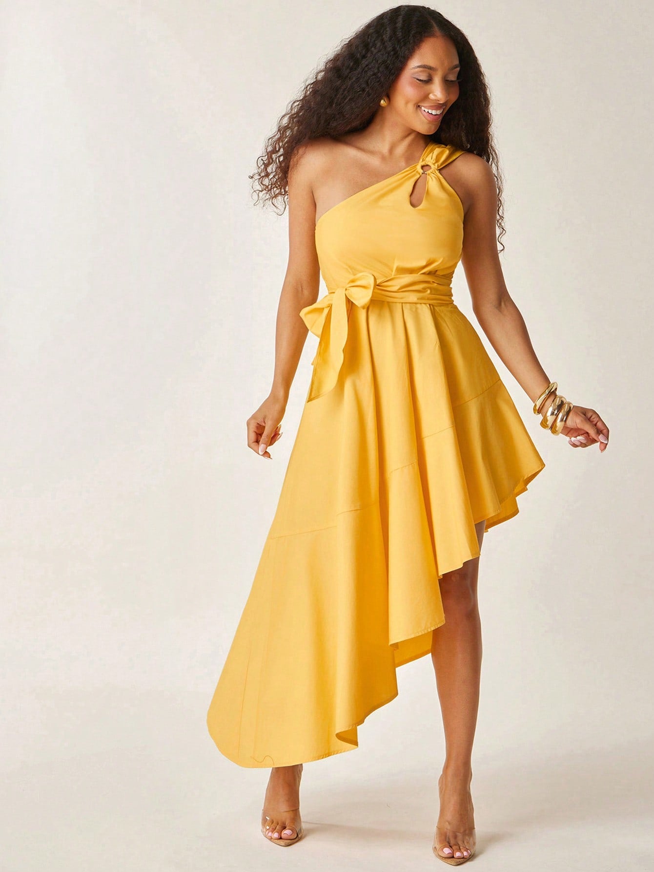 Brighten your summer wardrobe with this playful butter yellow dress featuring a flirty one-shoulder design and a charming ruffle hem. The self-tie belt cinches your waist for a flattering silhouette, making it perfect for elegant events or sunny days out. Effortlessly stylish and fun, this dress adds a splash of sunshine to any occasion.