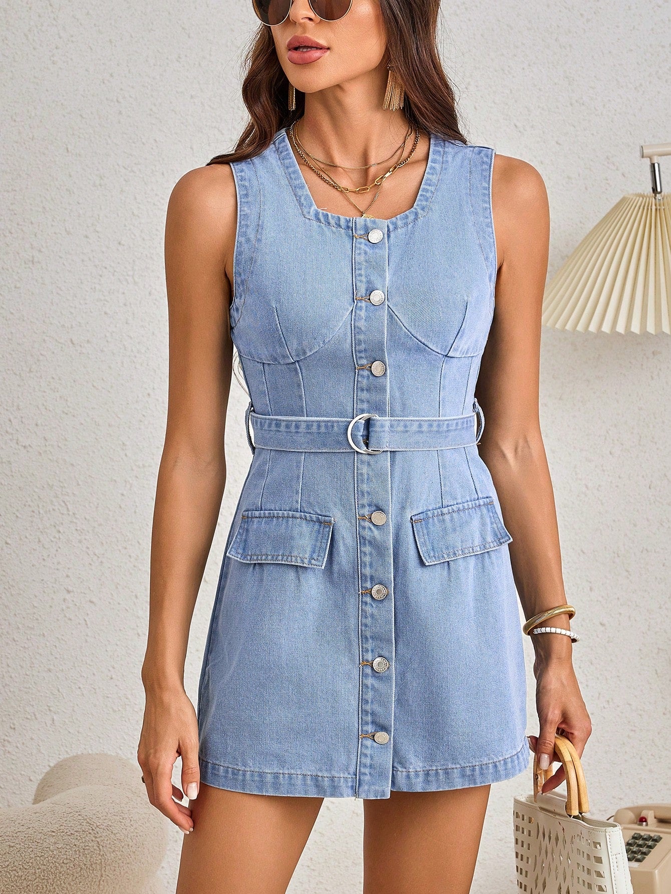 Looking for the perfect dress for any occasion? Look no further than our Chic Button-Front Belted Denim Dress! With its stylish design, flattering fit, and versatile belt, this dress will have you looking and feeling your best. Don't miss out on this must-have addition to your wardrobe!