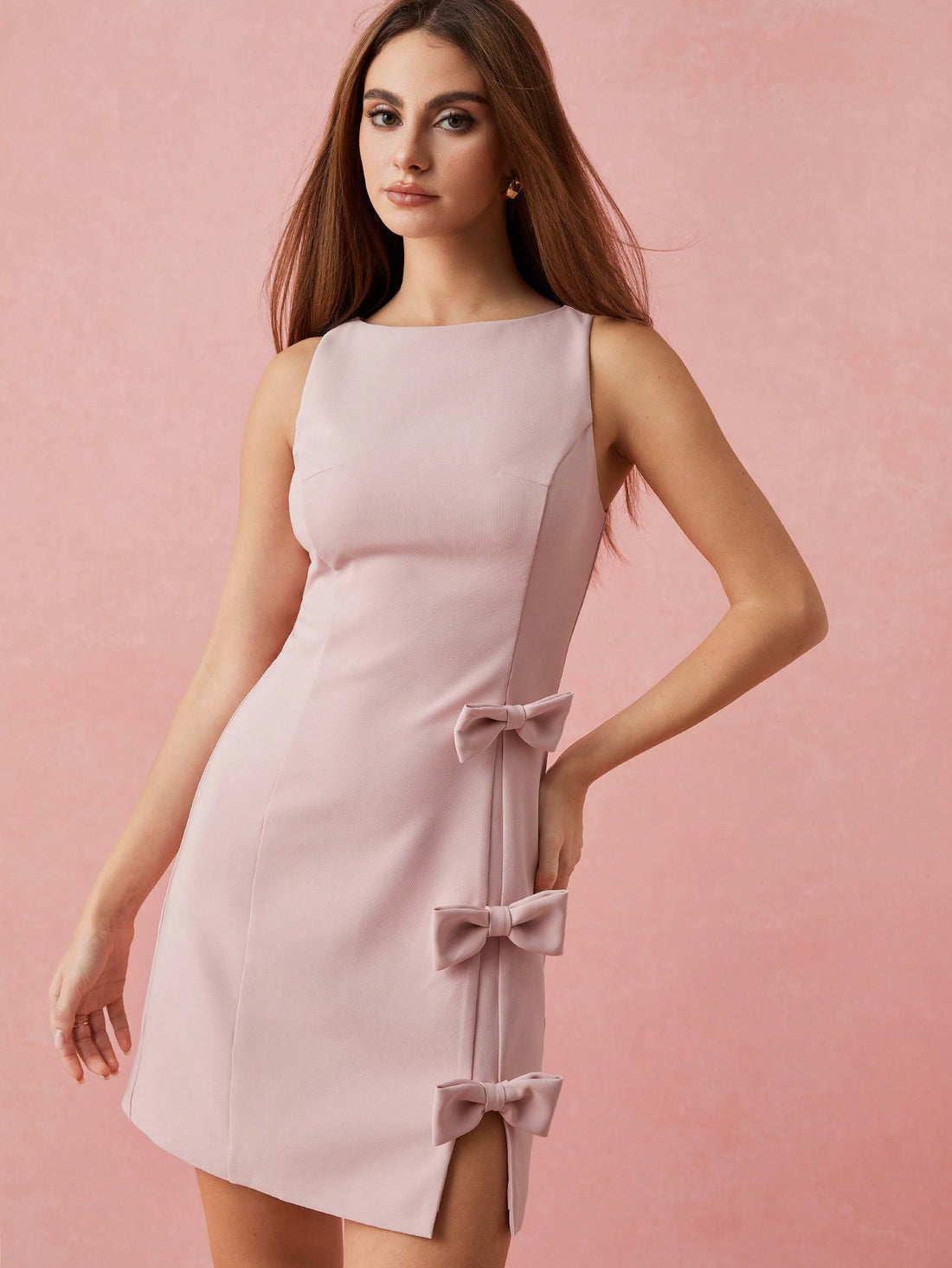 Be the picture of playful elegance in our Chic & Charming Soft Pink Bow Mini Dress. Perfect for romantic occasions and everyday charm, this dress boasts a soft pink hue and a charming bow detail. With a touch of whimsy and a dash of grace, this dress is sure to steal hearts.