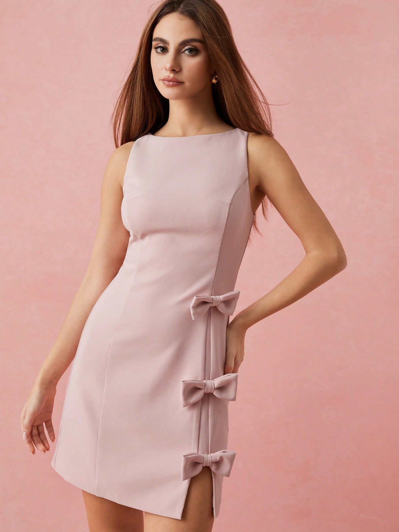 Be the picture of playful elegance in our Chic & Charming Soft Pink Bow Mini Dress. Perfect for romantic occasions and everyday charm, this dress boasts a soft pink hue and a charming bow detail. With a touch of whimsy and a dash of grace, this dress is sure to steal hearts.